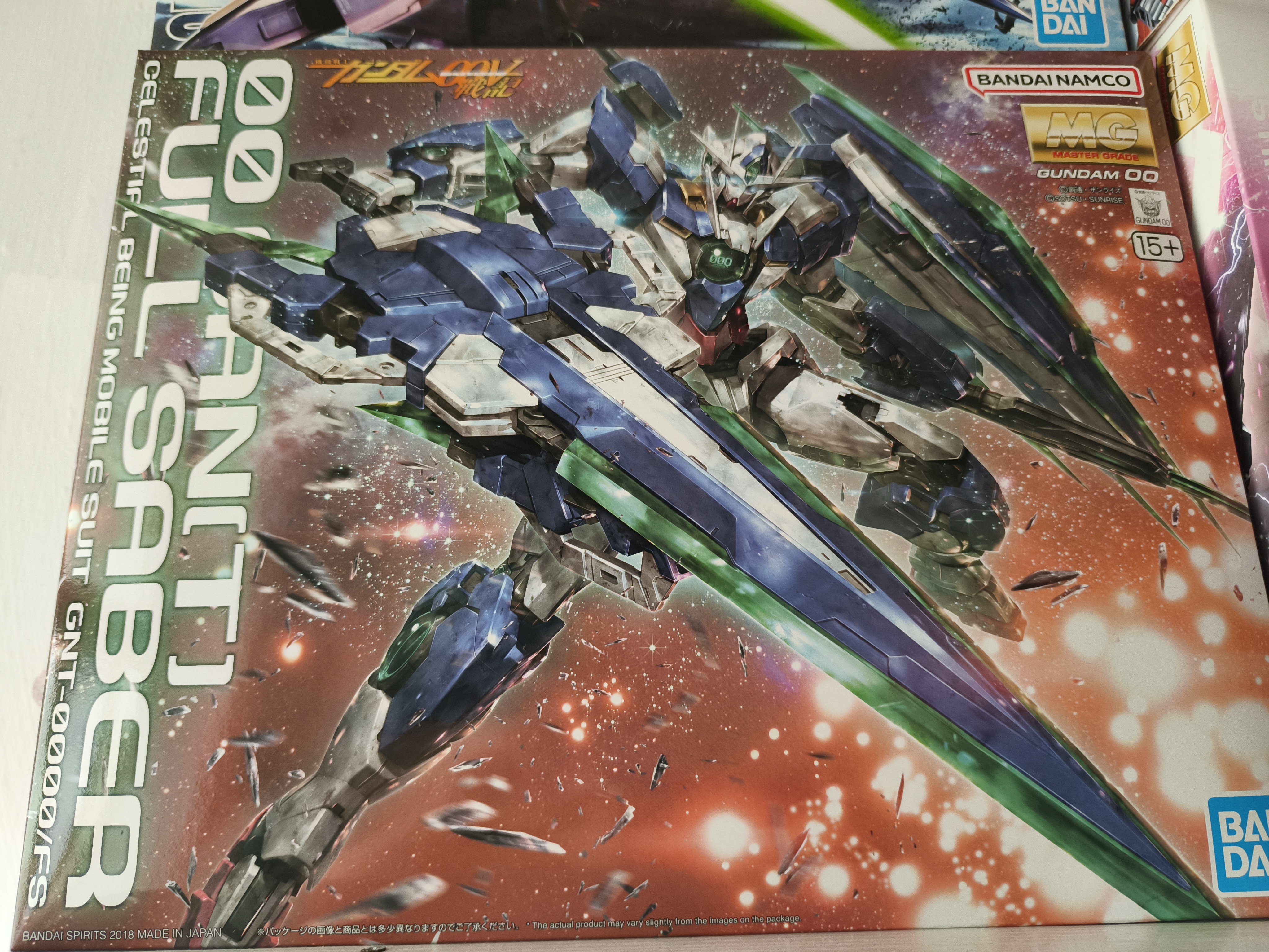 万代（BANDAI）万代 MG系列 高达模型 1/100 敢达拼装拼插模型 男孩生日玩具礼物 MG 量子型00高达 全刃式 实拍图