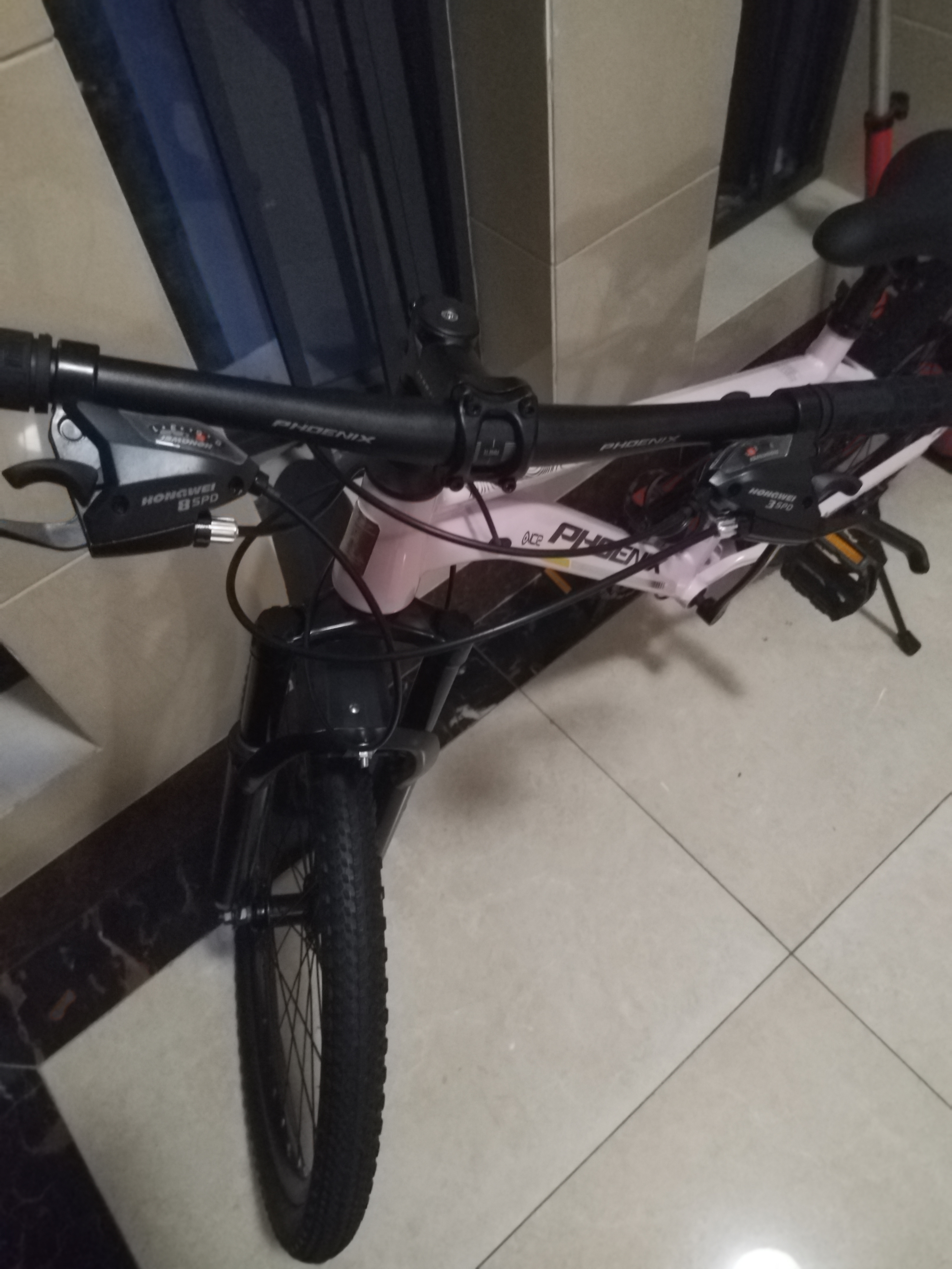 凤凰（Phoenix） 上海凤凰山地自行车成人男士女式学生变速宽胎越野赛车公路单车 钢架辐条轮粉【省力全轴承】 24寸24速【参考:138-168cm】 实拍图