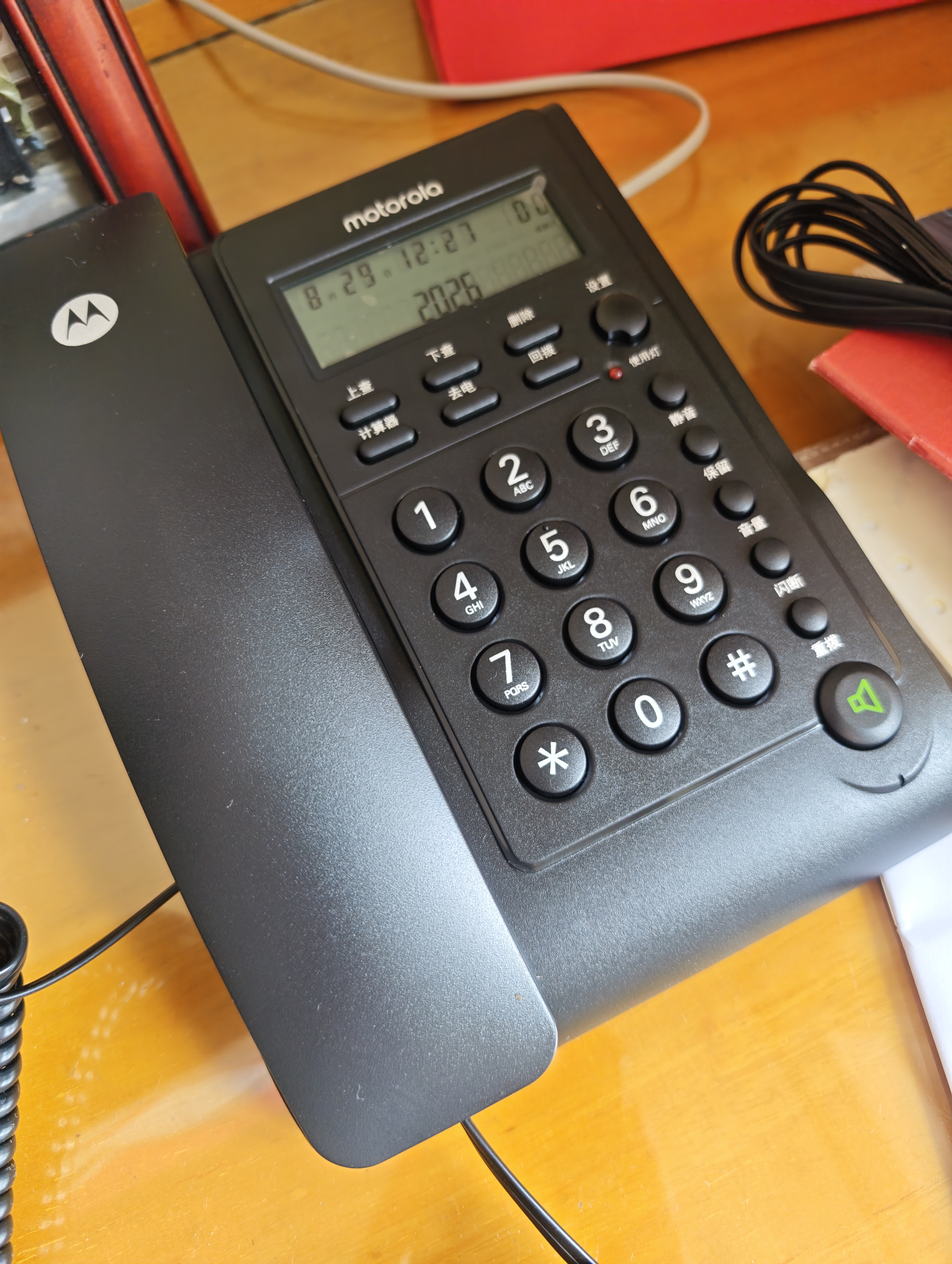 摩托罗拉（Motorola）电话机座机 蓝色背光 显示清晰 免提免打扰 桌墙两用 家用办公 有绳固定电话机 CT220黑色 实拍图