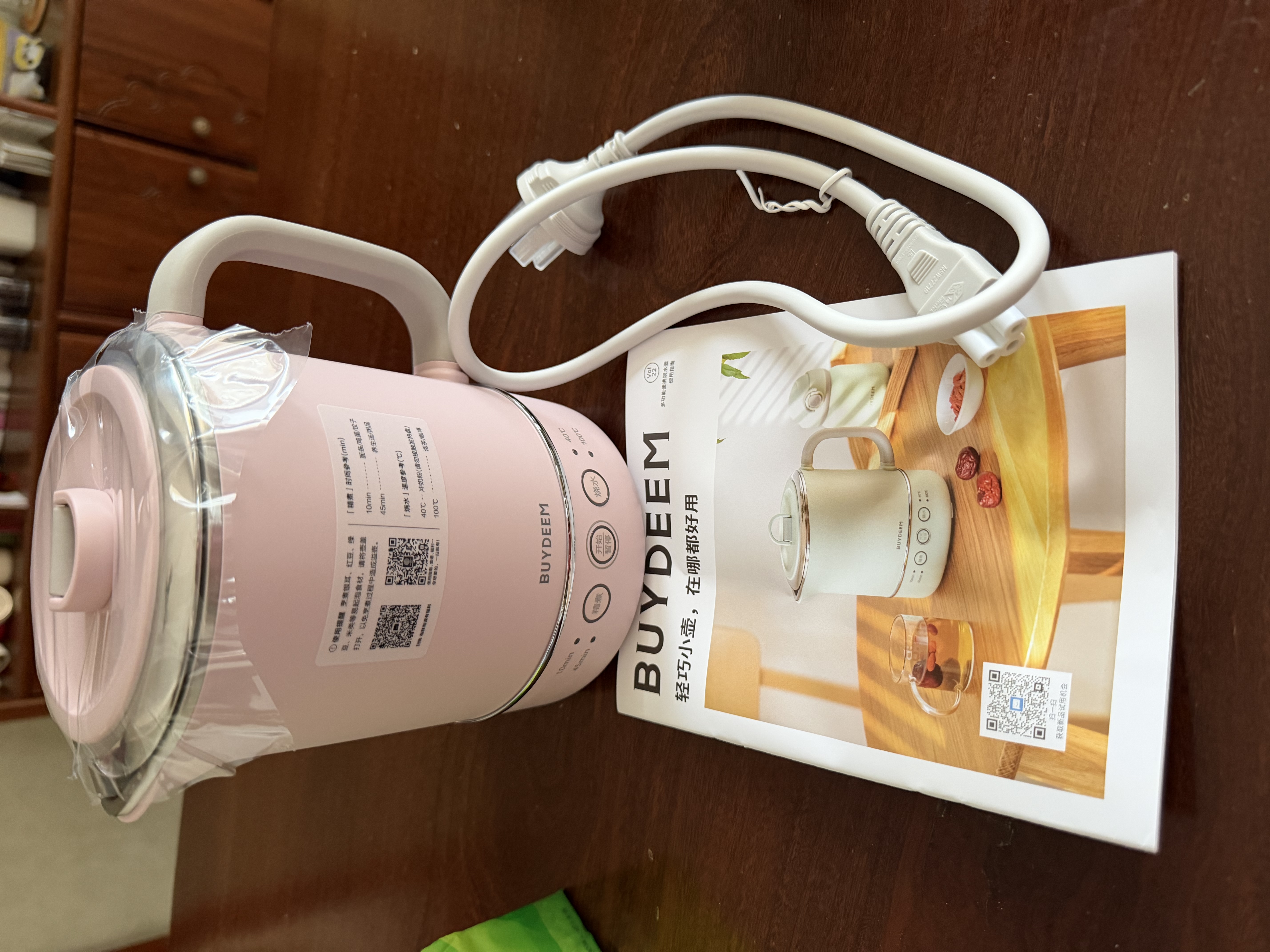 北鼎（Buydeem）宿舍多功能便携式烧水壶 出差旅行必备小型电热水壶 全球可用电水壶 全自动精煮恒温水壶 0.6L 【升级款-猪猪粉】便携式烧水壶TK66 实拍图
