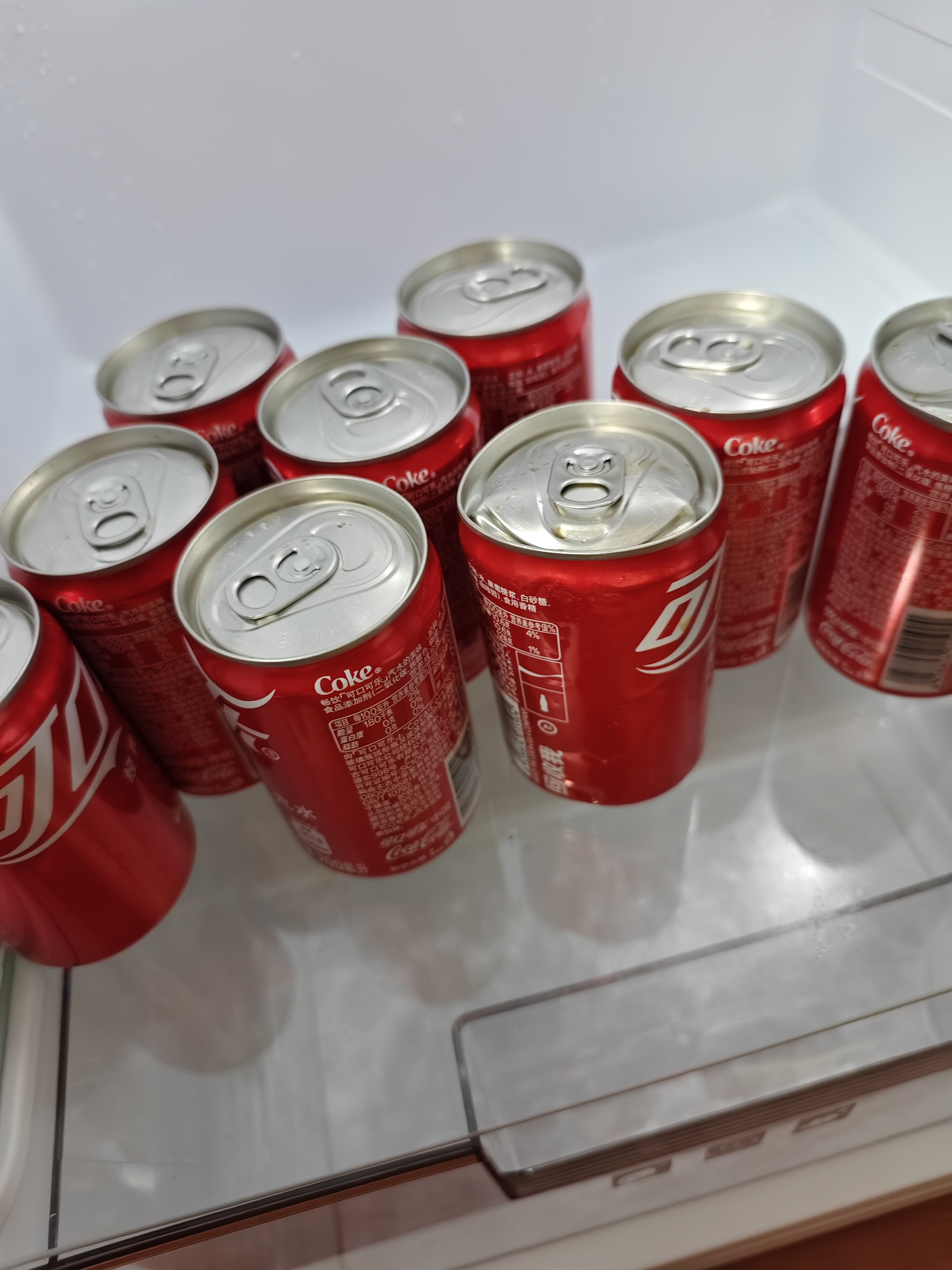 可口可乐（Coca-Cola）汽水 碳酸饮料 200ml*12罐  迷你摩登罐 新老包装随机发货 实拍图