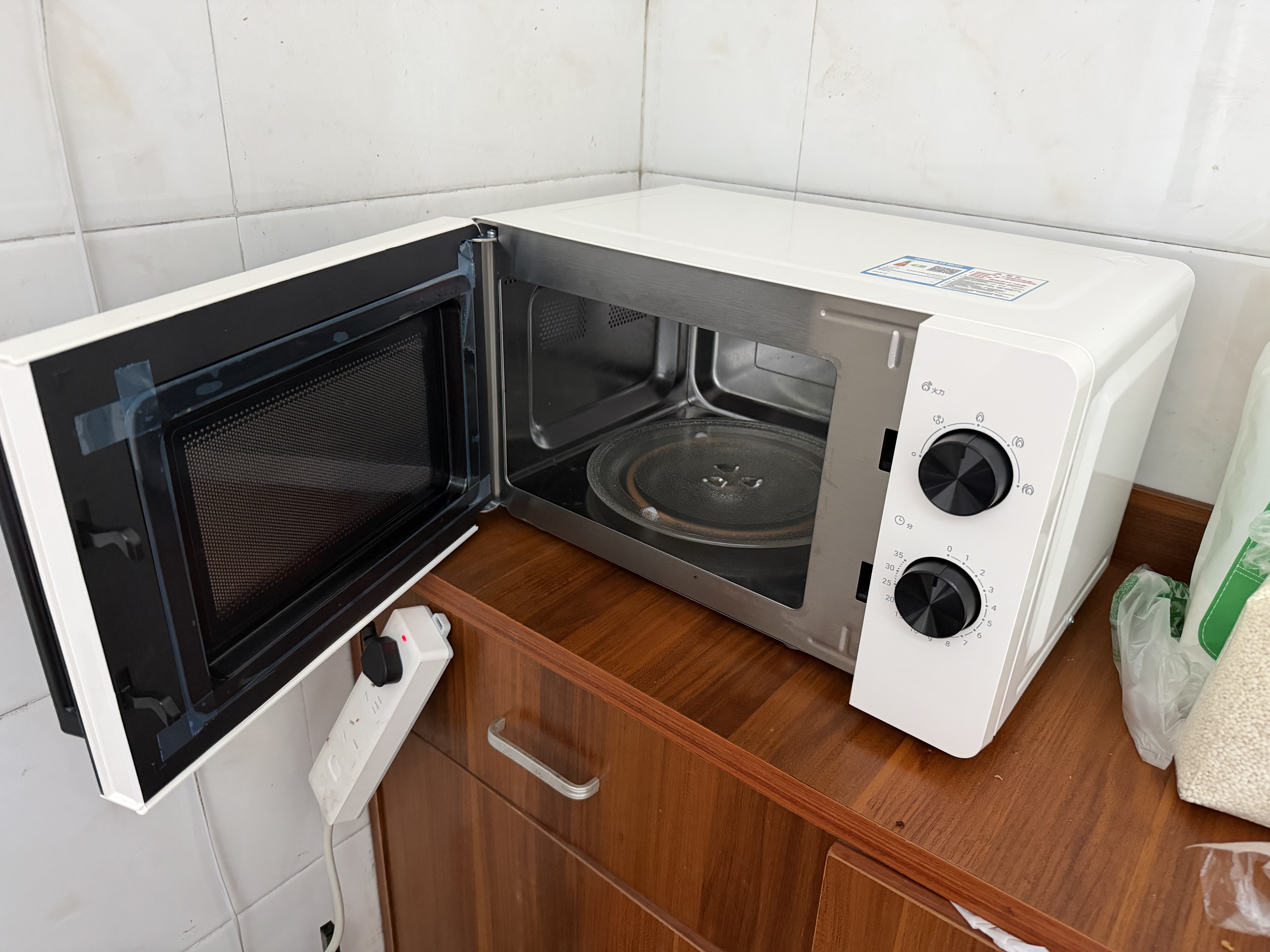 海尔（Haier）白巧不锈钢微波炉 0涂层360°转盘加热 旋转操作易洁耐用内胆 家用小型 老人适用 HW-M2003JW 实拍图