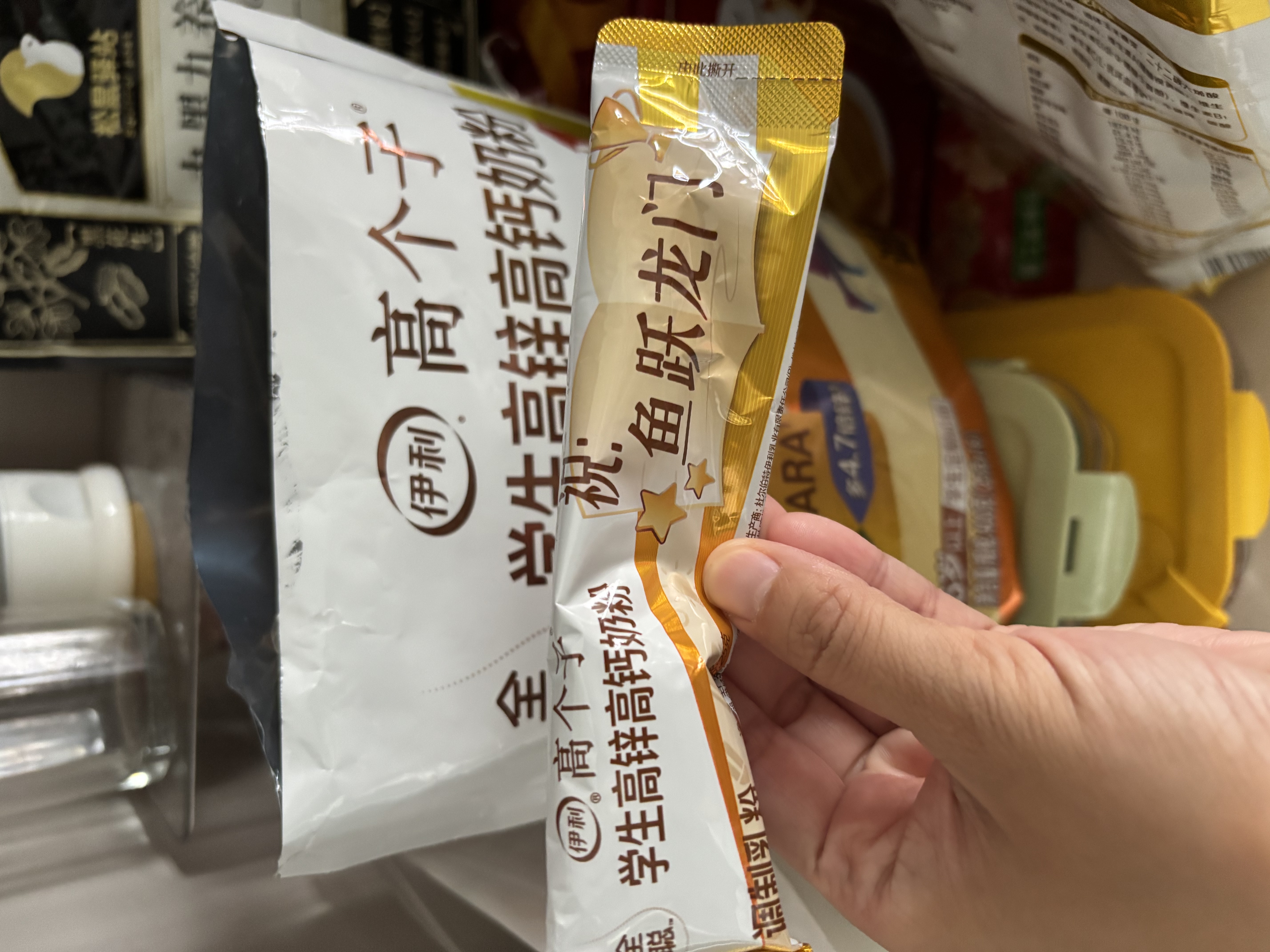 伊利学生高锌高钙奶粉400g袋装 儿童青少年 添加DHA+ARA 25g*16便携条 实拍图