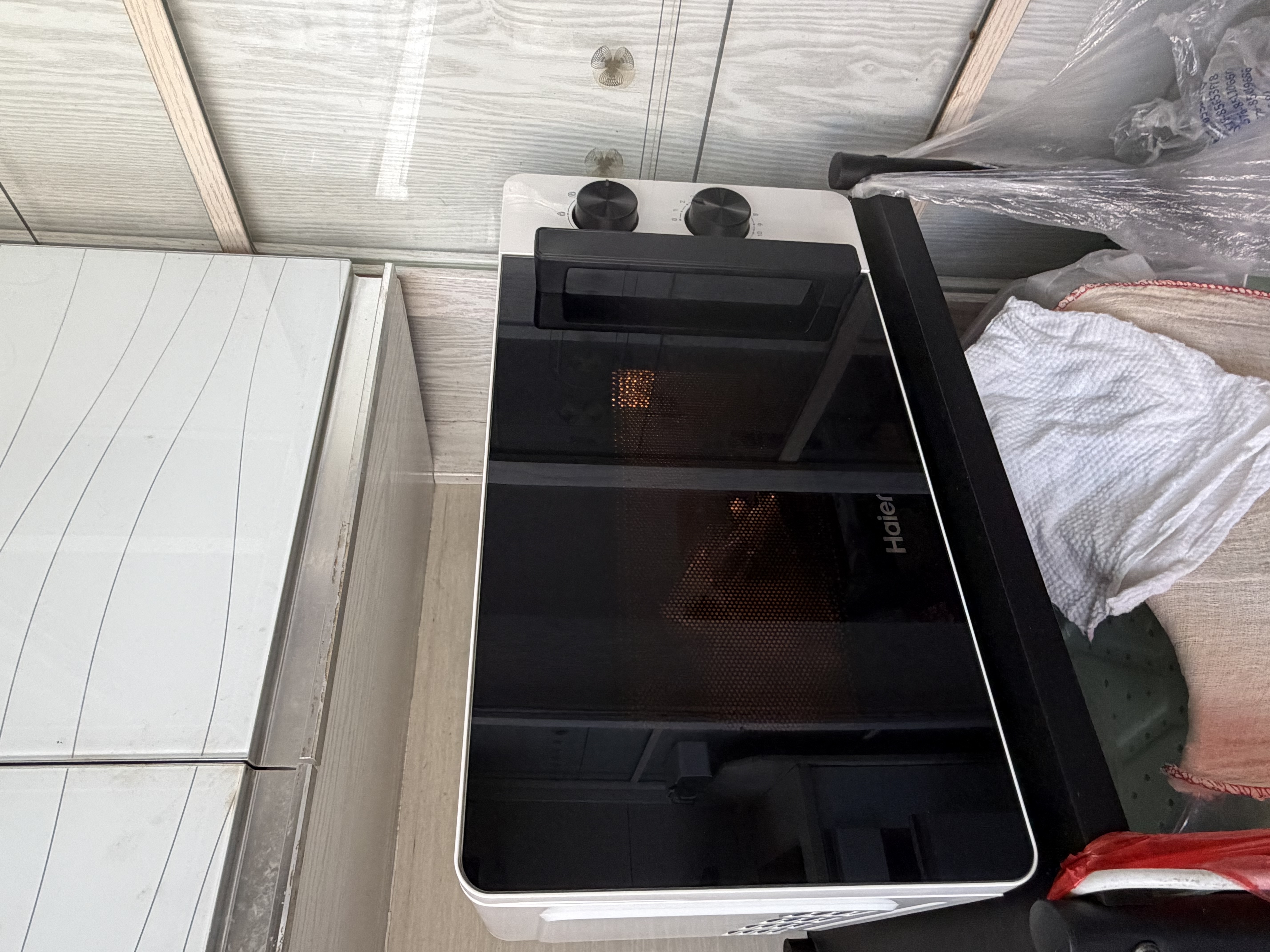 海尔（Haier）白巧不锈钢微波炉 0涂层360°转盘加热 旋转操作易洁耐用内胆 家用小型 老人适用 HW-M2003JW 实拍图