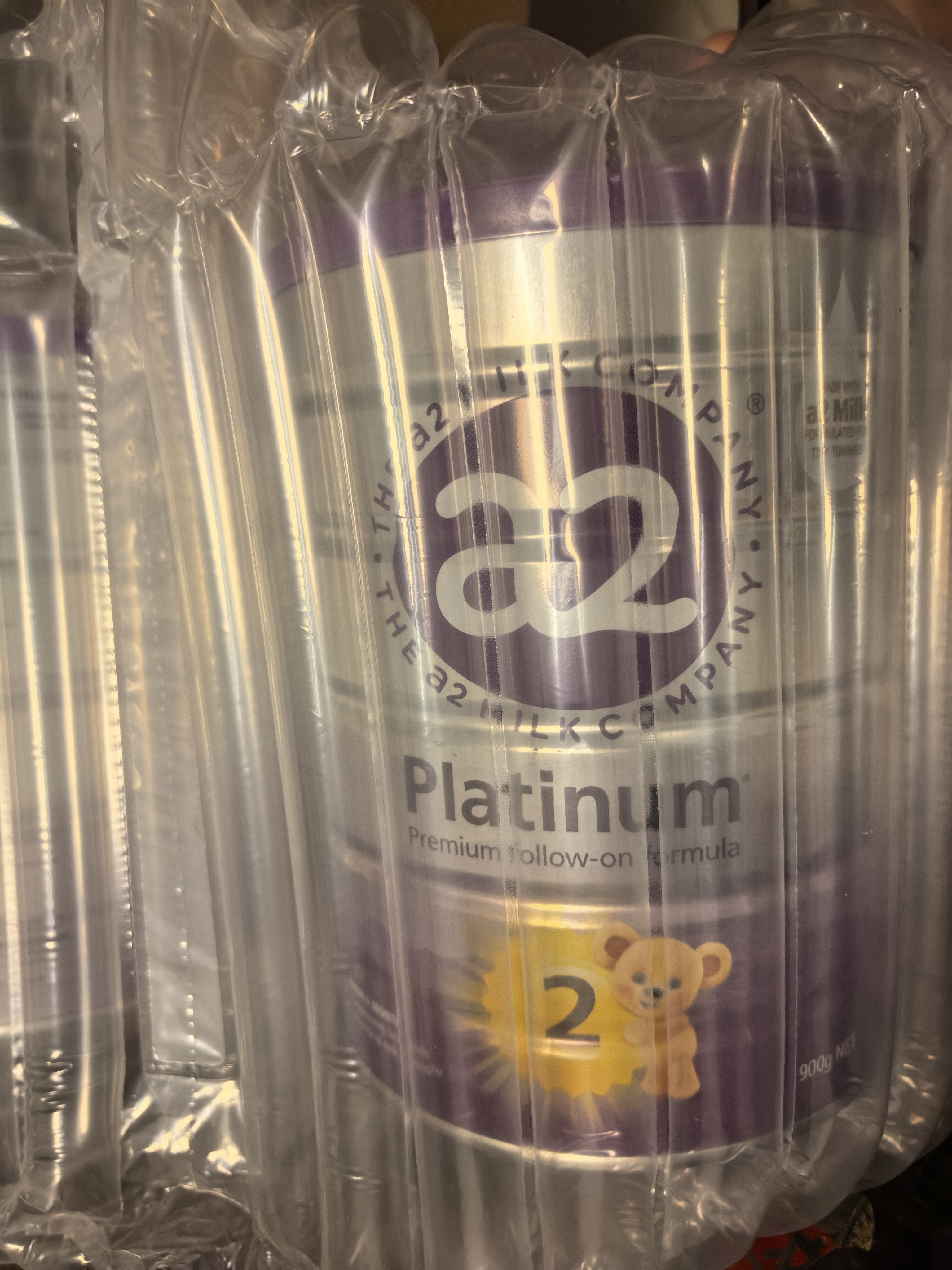 a2奶粉紫白金版 新西兰原装进口 1234段婴幼儿配方奶粉含天然A2蛋白 【小罐试喝+30E卡】2段 900g 3罐 效期至28年5月 实拍图