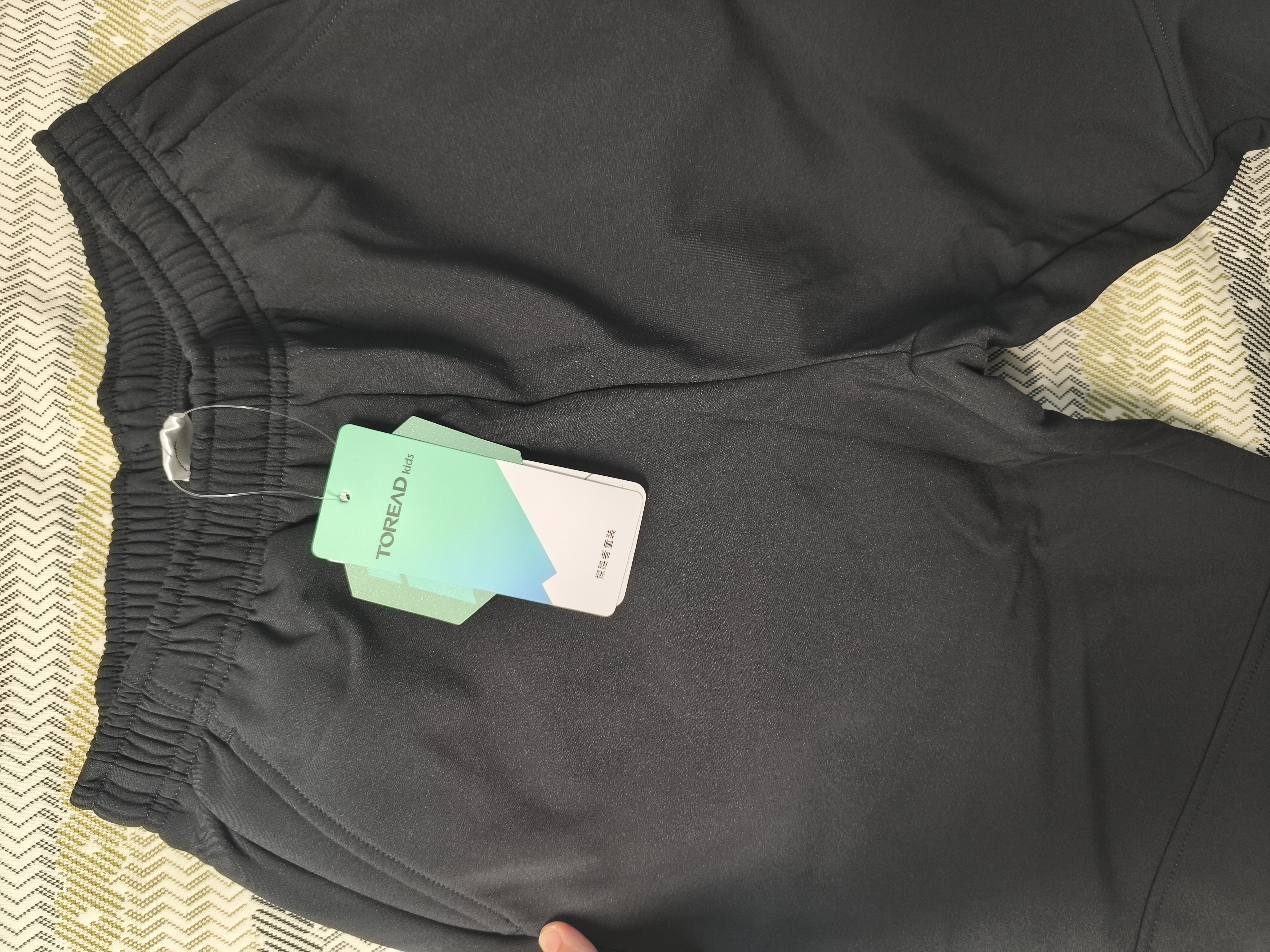 探路者（TOREAD）男女童裤子 秋冬季款童装儿童运动休闲软壳裤QAMMBN95686 暗夜黑 150 实拍图