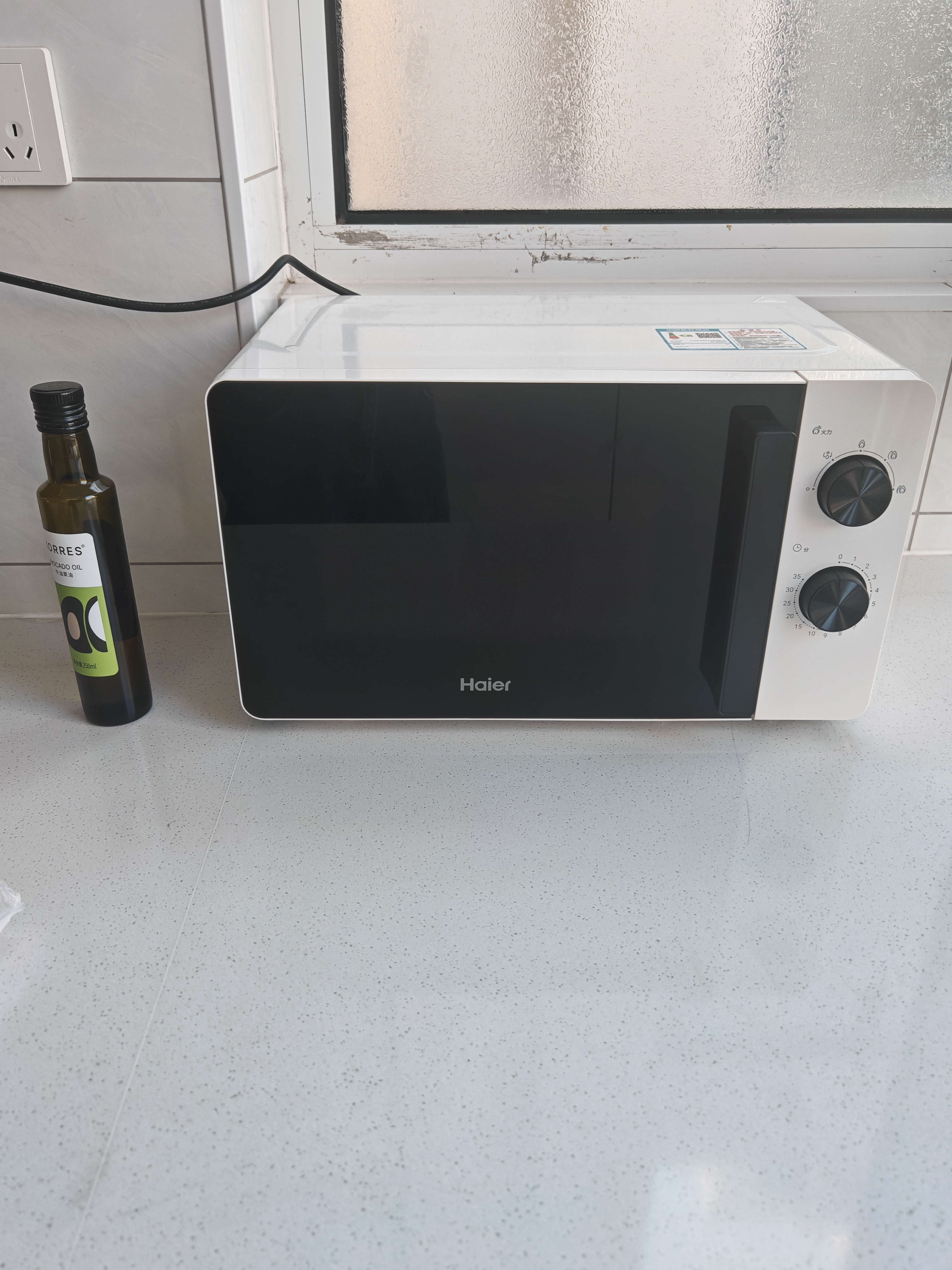海尔（Haier）白巧不锈钢微波炉 0涂层360°转盘加热 旋转操作易洁耐用内胆 家用小型 老人适用 HW-M2003JW 实拍图