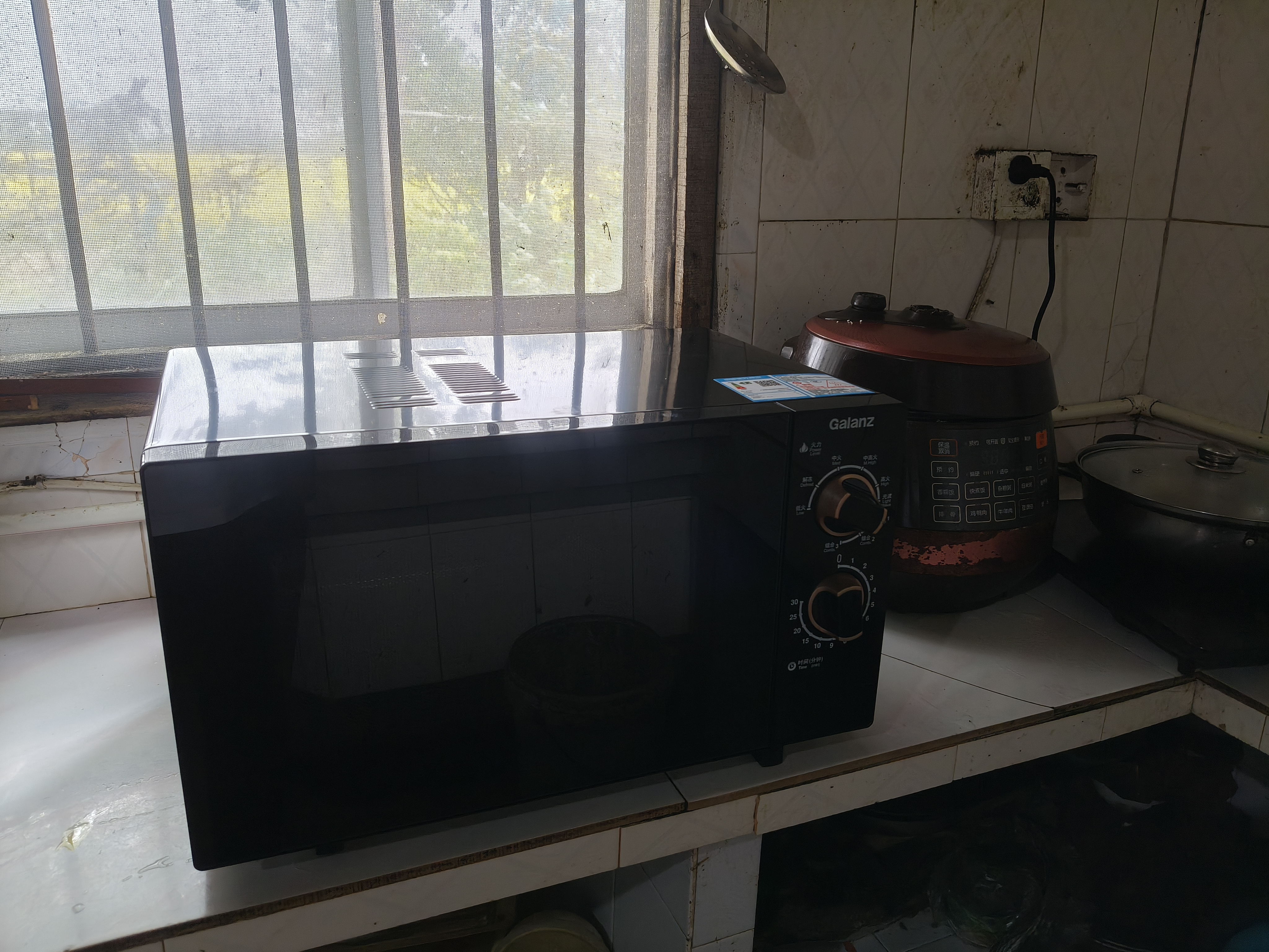 格兰仕（Galanz）微波炉烤箱一体机0涂层不锈钢内胆23升大容量900W变频一级能效平板式家用旋钮光波炉2026新款M8B 实拍图