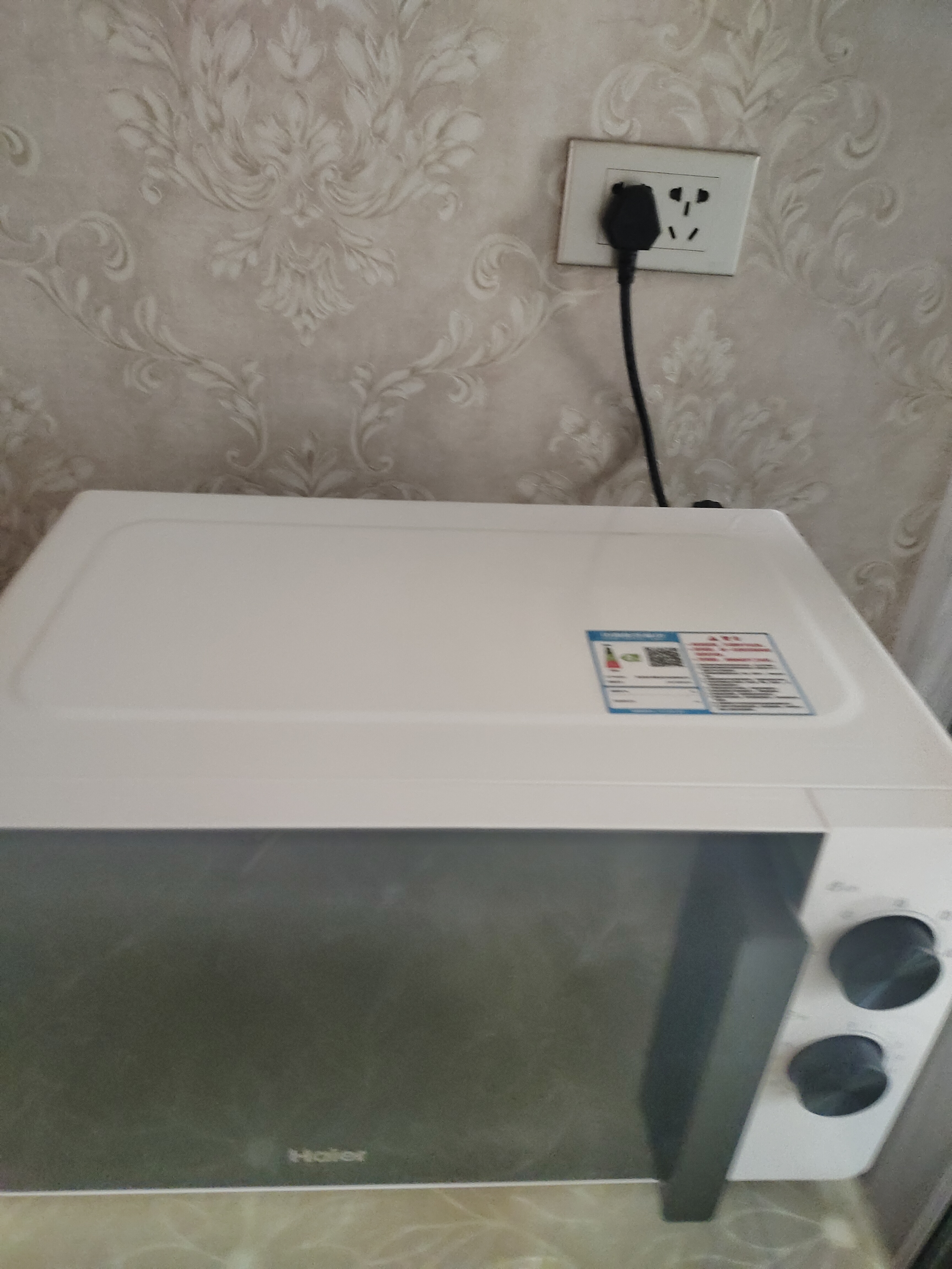 海尔（Haier）白巧不锈钢微波炉 0涂层360°转盘加热 旋转操作易洁耐用内胆 家用小型 老人适用 HW-M2003JW 实拍图