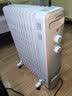 美的（Midea）【金缕衣】家用电热油汀取暖器立式电暖器 13片电暖气 全屋升温取暖神器/节能加湿烘衣NY2213-18GW 实拍图