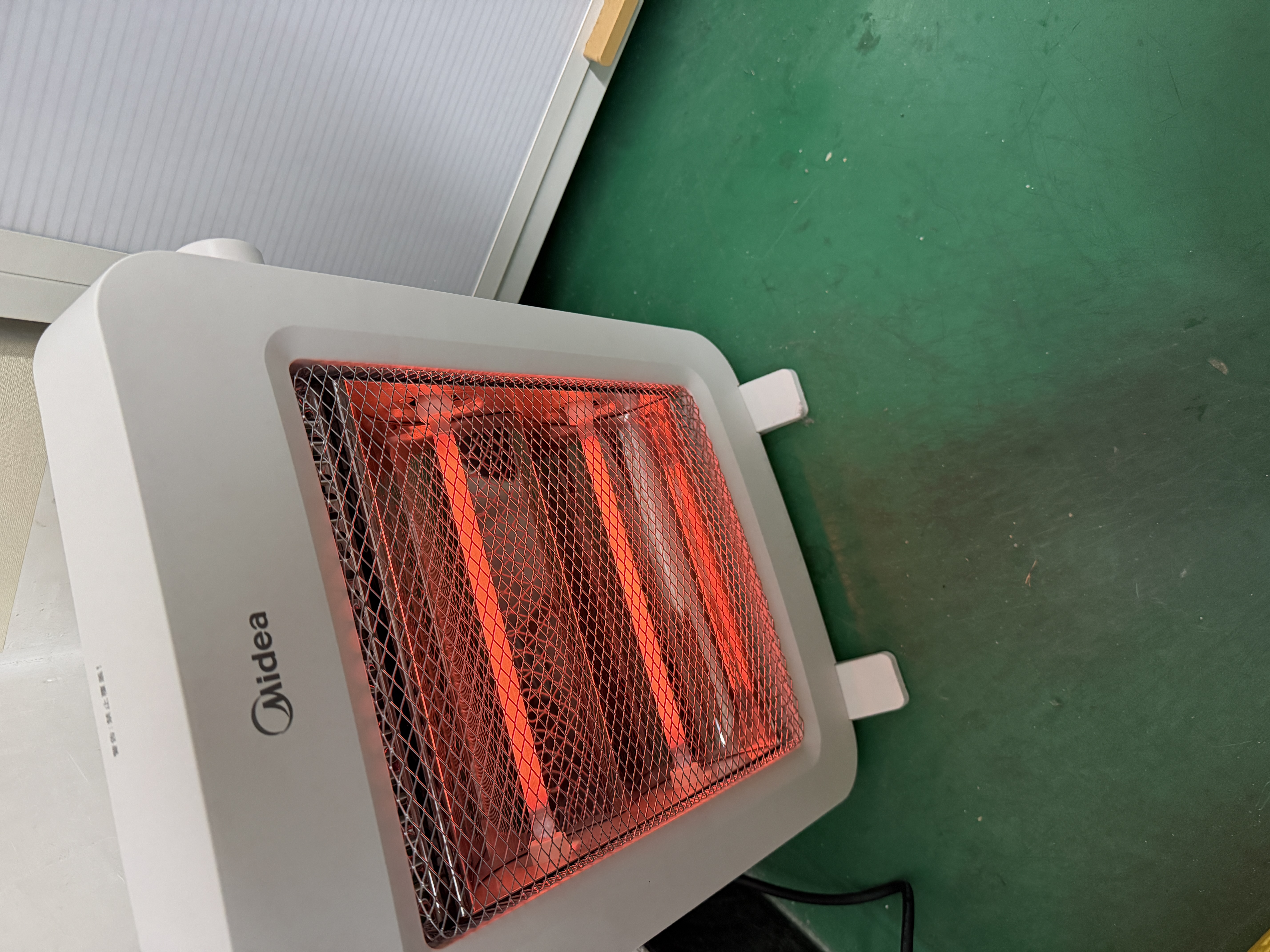 美的（Midea）【轻暖随行】家用取暖器/电暖器/电暖气/远红外/小太阳/取暖炉/迷你节能台式办公室烤火炉 NPS-MH 实拍图