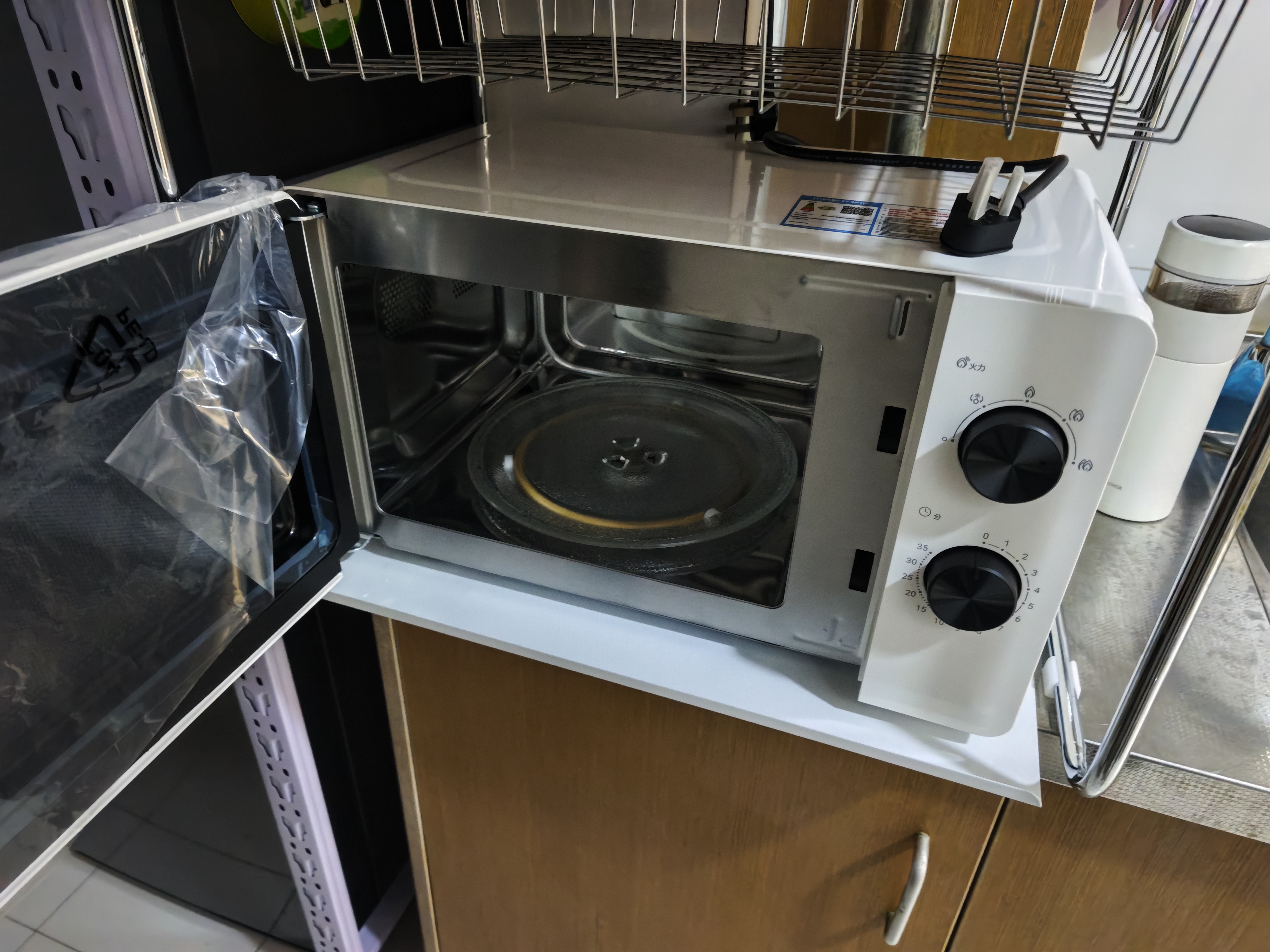 海尔（Haier）白巧不锈钢微波炉 0涂层360°转盘加热 旋转操作易洁耐用内胆 家用小型 老人适用 HW-M2003JW 实拍图