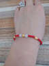 相思结 黄金手链 999足金本命年红绳男女可配情侣转运珠路路通 如图 约0.7-0.9g 实拍图