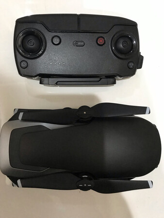 原装正品，没问题。充电40分钟就能充满，可以飞20分钟。这次京东搞活动价格还是比较给力，包装很好，物流到货也比较快。Air尺寸很轻巧，比手掌长一点，自带原装便携包，放在外套兜里没有压力。多买了一块电池替换基本足够了，出去旅游还是要多买一张microSD卡才能确保有足够的存储空间。