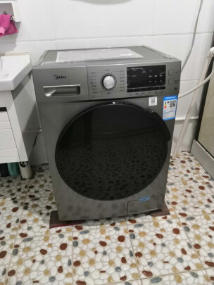 美的洗衣机怎么样,属于什么档次,是真假 