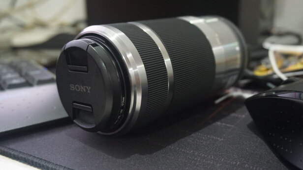 SONY SEL55210与尼康35mm f/1.8G有区别没有？哪款做工扎实，哪个有效防抖？