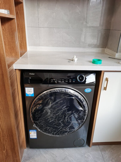 海尔(haier)纤美滚筒洗衣机:"外形外观:外观漂亮,上档次洗净效果:没有