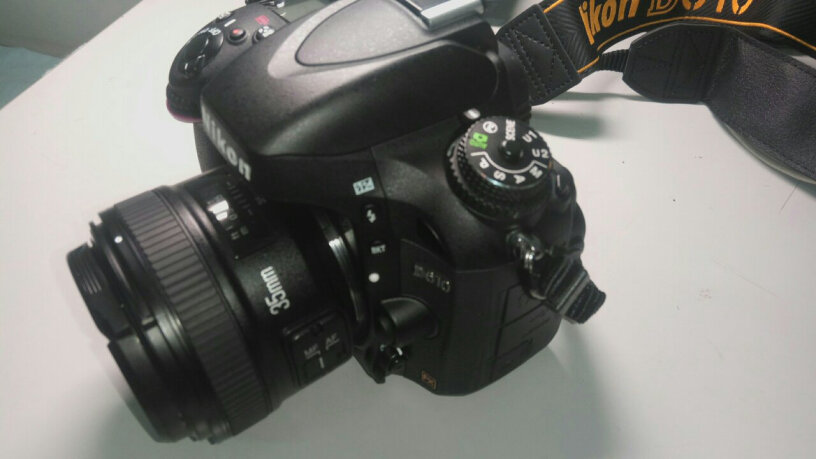 永诺YN35mm F2N 定焦镜头这个是残幅机和全幅机都能用的么？