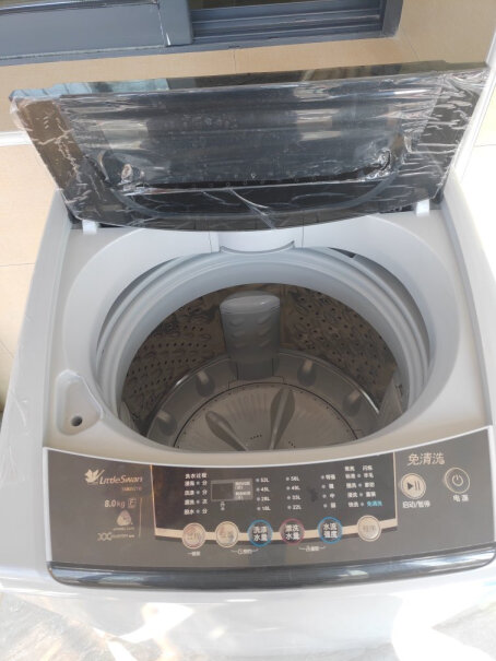 小天鹅9公斤请问这款洗衣机的排水管在左侧还是右侧，谢谢！