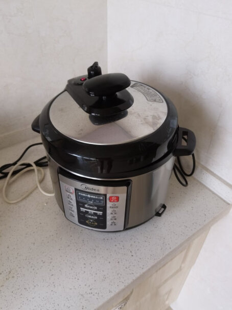 美的电压力锅5升双胆家用高压锅这个煮饭要多久？？