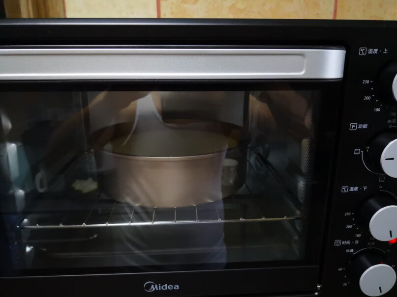 美的烤箱家用烘焙迷你小型电烤箱多功能台式蛋糕烤箱25L这可以拿来热菜吗？
