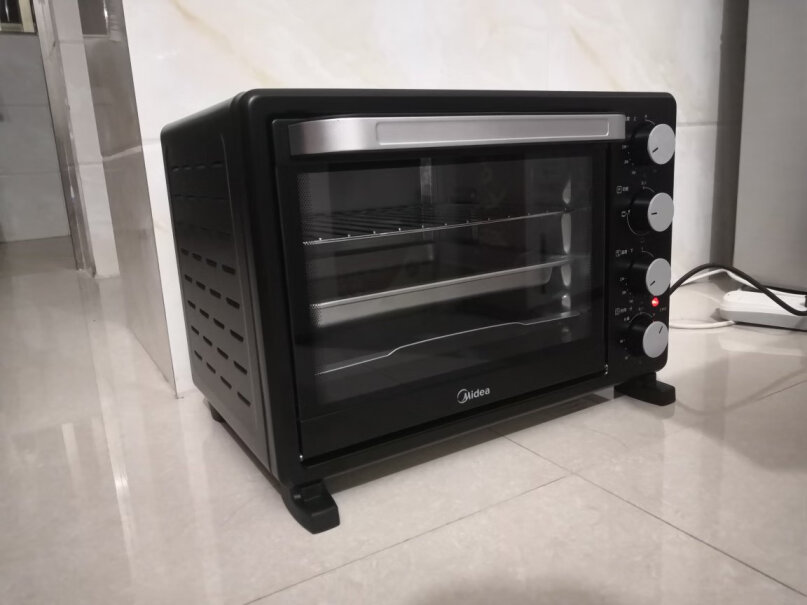 美的烤箱家用烘焙迷你小型电烤箱多功能台式蛋糕烤箱25L十寸蛋糕烤盘可以放进去吗？