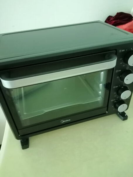 美的烤箱家用烘焙迷你小型电烤箱多功能台式蛋糕烤箱25L没有灯吗？