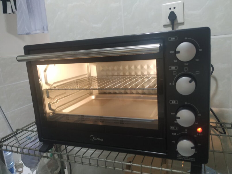 美的家用电烤箱烤箱双层烤怎么控制上下管的温度？