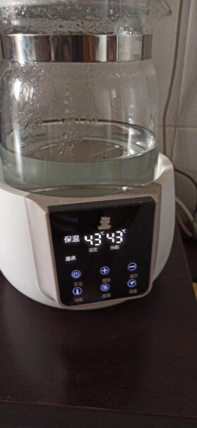 小白熊恒温调奶器1.2L这个怎么降低温度的？煮沸后等他自然晾到设定温度还？