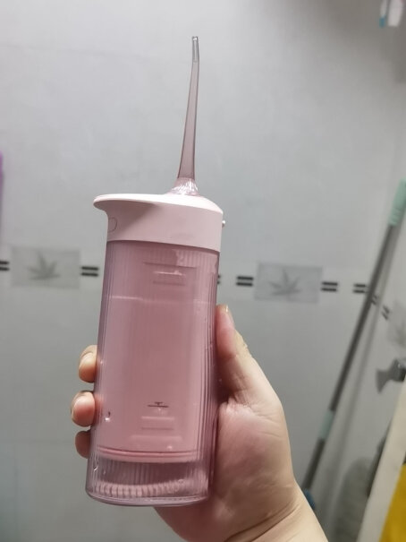 素士冲牙器筒式收纳便携洗牙器洁牙机水牙线W1樱花粉小米的好还是这个好？