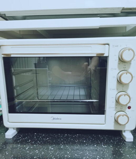美的烤箱25升家用烘焙多功能迷你烤盘放的位置会影响受热效果吗？