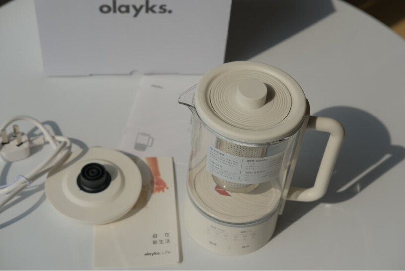 欧莱克茶壶养生原款电热水壶olayks养身煮茶便携烧水有塑料味道吗？