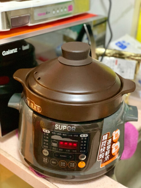 苏泊尔电炖锅电炖盅刚开箱锅内胆底中心有很重的锅底灰是怎么回事，是用过的锅吗？