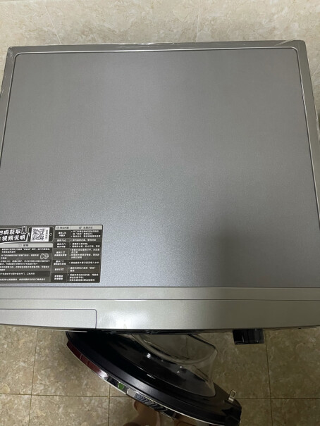 LittleSwan10KG超薄滚筒全自动小天鹅洗衣机这款洗衣机开合的门是玻璃的还是塑料的？据说外面一层是塑料的？