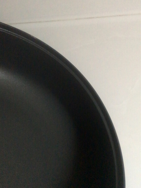 九阳炒锅28cm不粘炒菜锅锅盖上面的的垫片在外面还是里面？
