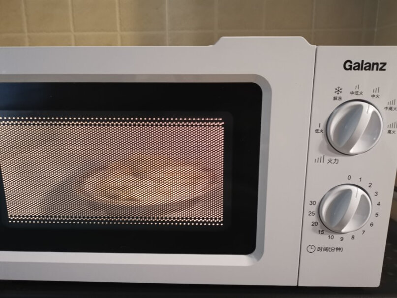 格兰仕微波炉6档火力调节煮好的饭菜在冰箱里拿出来加热大概要多久和什么火力呢？