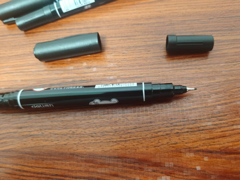 得力deli黑色双头记号笔美术绘画勾线笔12支请问可以在照片上写字么？不会花吧？
