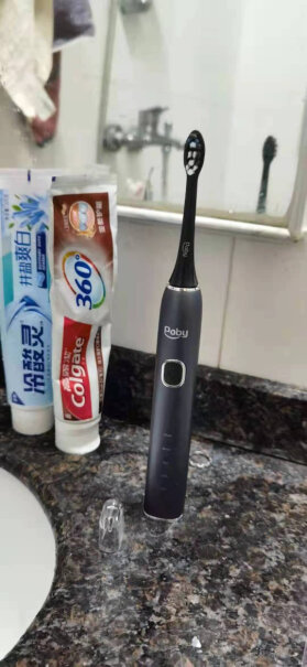 Poby电动牙刷这个牙刷是震动一下就换一个地方刷吗？