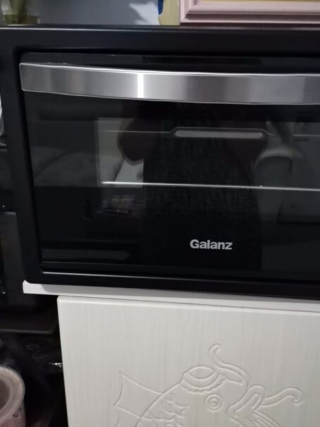 格兰仕全自动智能电烤箱家用这个烤箱工作时灯是一直两个吗？