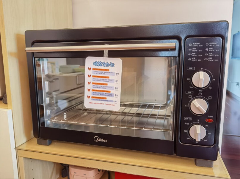 美的家用多功能电烤箱25升能放整只鸡鸭进去烤吗？