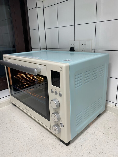 美的家用多功能电烤箱25升可以热菜吗？