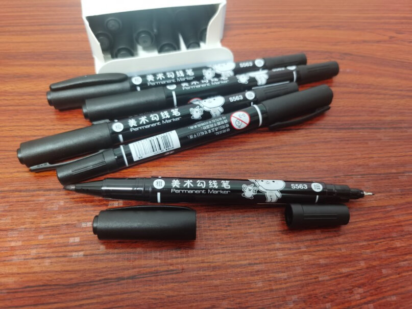 得力deli黑色双头记号笔美术绘画勾线笔12支普通的本子会印到背面吗？