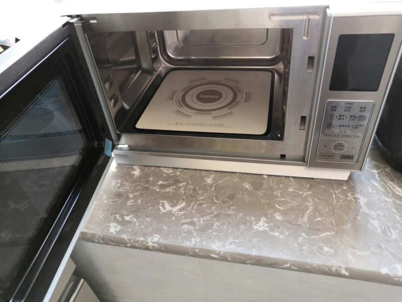 格兰仕家用平板加热快捷光波炉微烤一体机微波变频外壳带电吗？