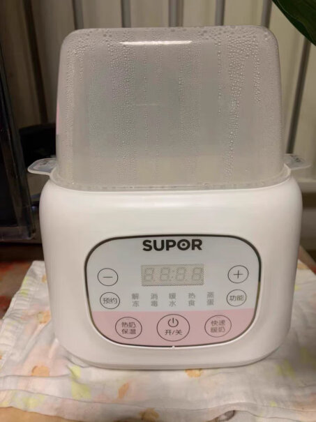 苏泊尔婴儿恒温暖奶器调奶器消毒器二合一你们买的时候多少钱 能放两个贝亲的玻璃奶瓶么？