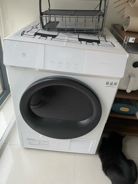 米家小米热泵式烘干机10公斤全自动家用干衣机洗衣机伴侣烘干机上面会烫吗？可以直接在上面放东西吗？