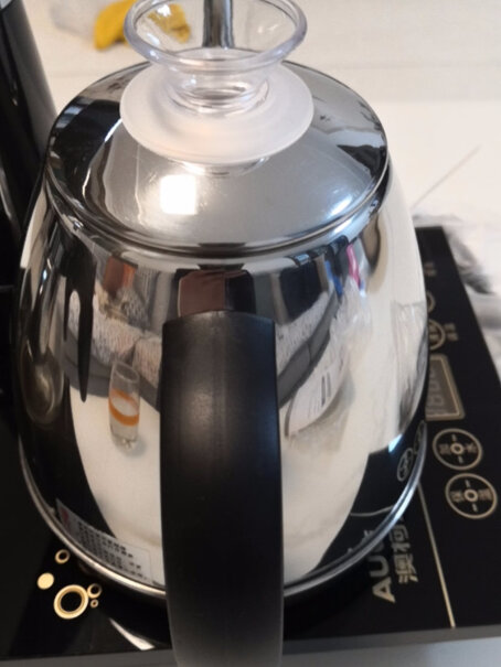 澳柯玛自动旋转上水壶电热水壶功夫泡茶304不锈钢烧水壶你好，我购买的烧水壶使用后托盘底部塑料消融，但是其他物品都很不错，只想换电磁炉，可以吗？