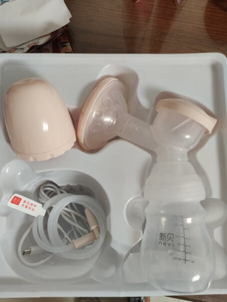 新贝电动吸奶器带哺乳灯你们充电头用什么充，家里苹果充电头可以吗？