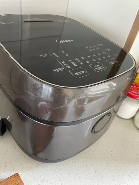 美的电饭煲家用智能触控电饭锅IH电磁加热粘锅吗？
