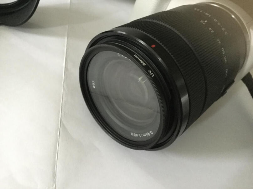 索尼APS-C微单E口变焦镜头E55-210mma300 型号能配此镜头吗？