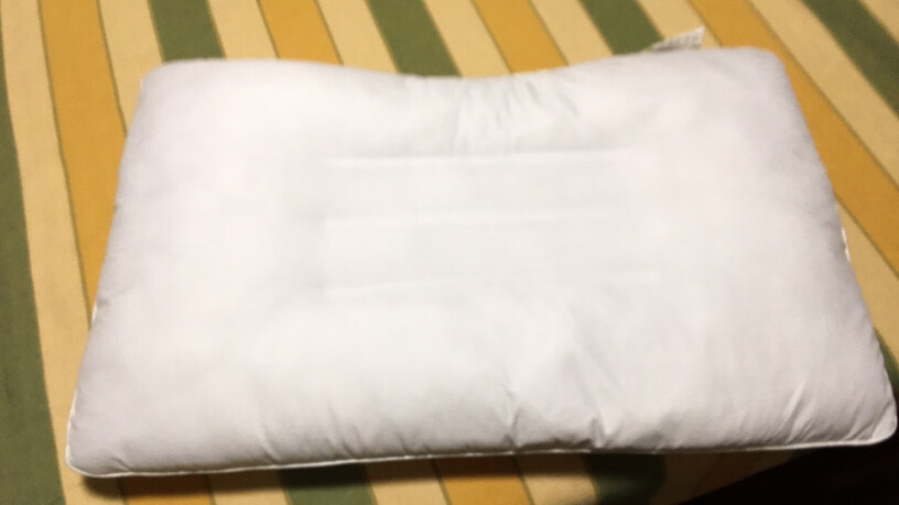 富安娜家纺圣之花枕头芯颈椎枕草本枕芯是软的还是硬点的？